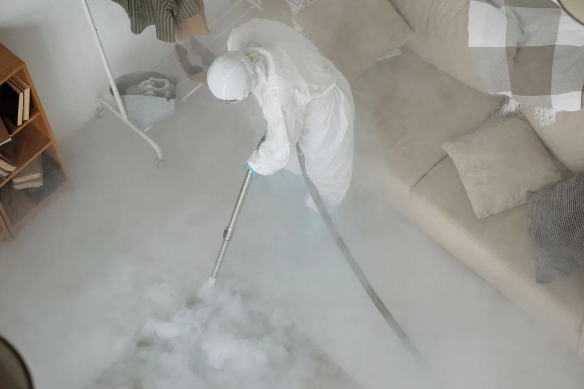 Biohazard cleanup technician in protective equipment, Indian Hills, Wichita, KS